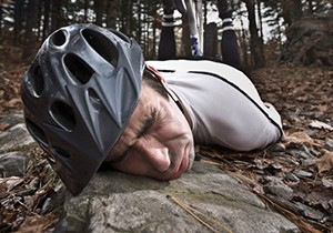 Photo of a cyclist on the ground